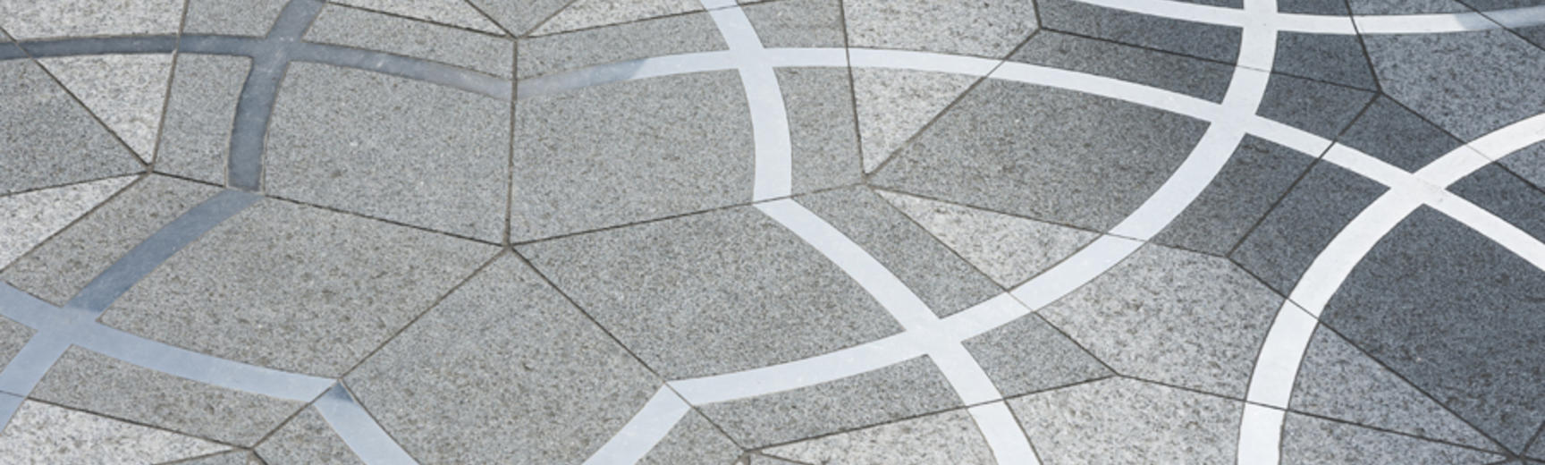 A pattern of tessellated grey tiles in the shape of stars