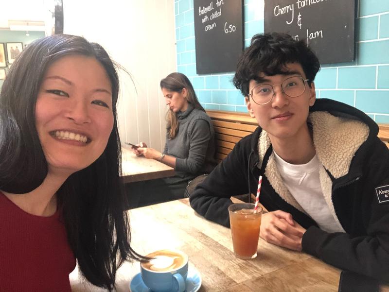 Jenny cover image two people sitting in a cafe smiling at the camera