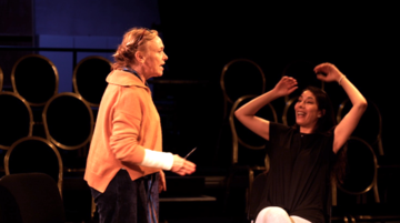 two actors on stage 